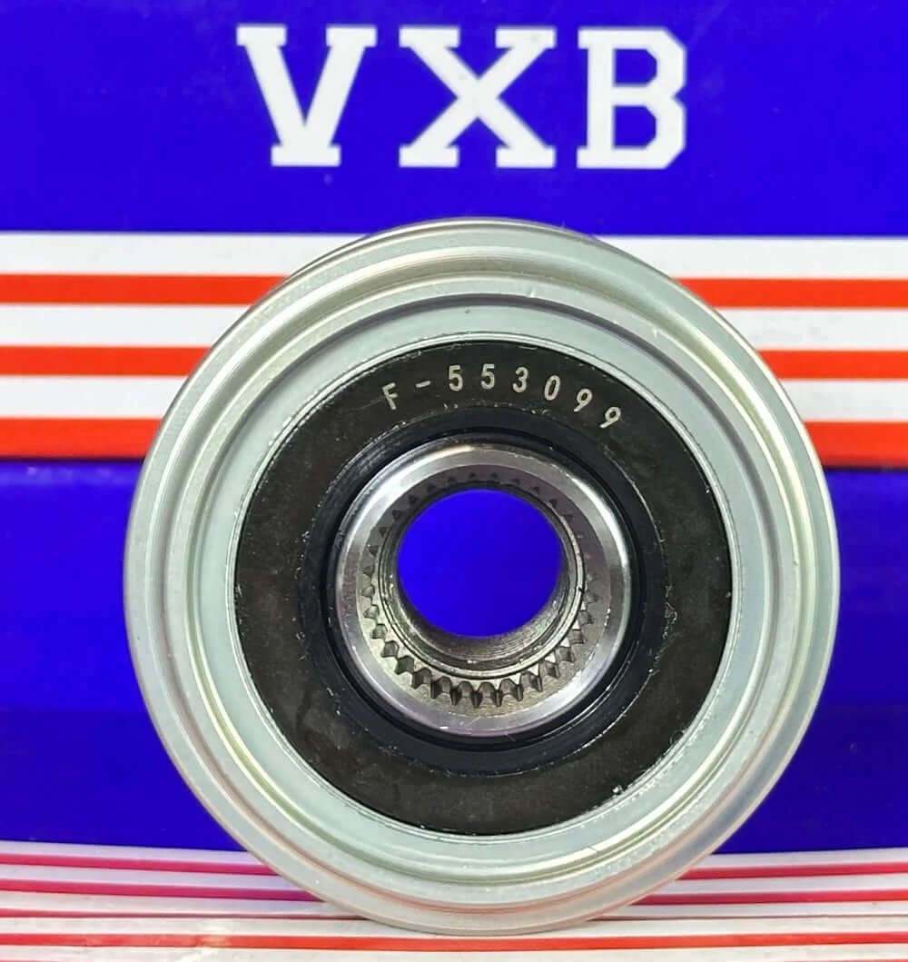 F-553099 Alternator Freewheel Clutch Pulley Bearing shown from the front, featuring a metallic outer ring and inner gear.