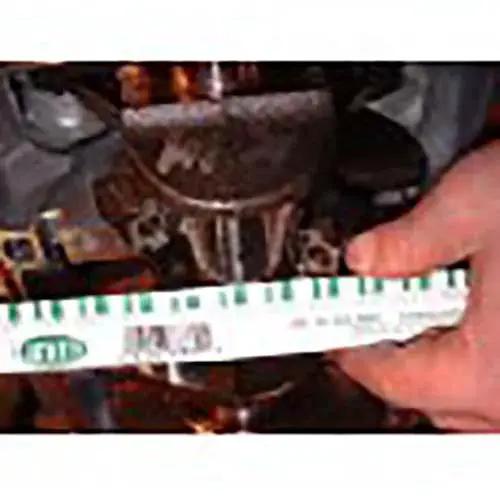 Person using Plastigage Green Bearing Clearance Gauge Standard And Metric Pack Of 1 for engine measurement