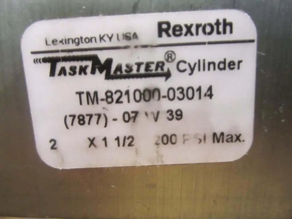 Label on Rexroth Bosch TM82100003014 Hydraulic Cylinder showing model and specs, including TM-821000-03014 and max pressure 39200 PSI.