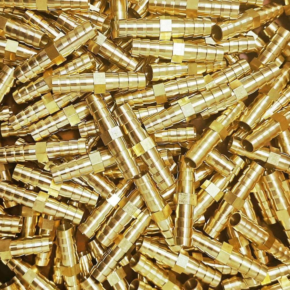 Pile of Three Eighths Inch Brass Hose Barb Splicer Mender Fittings visible with durable brass construction.