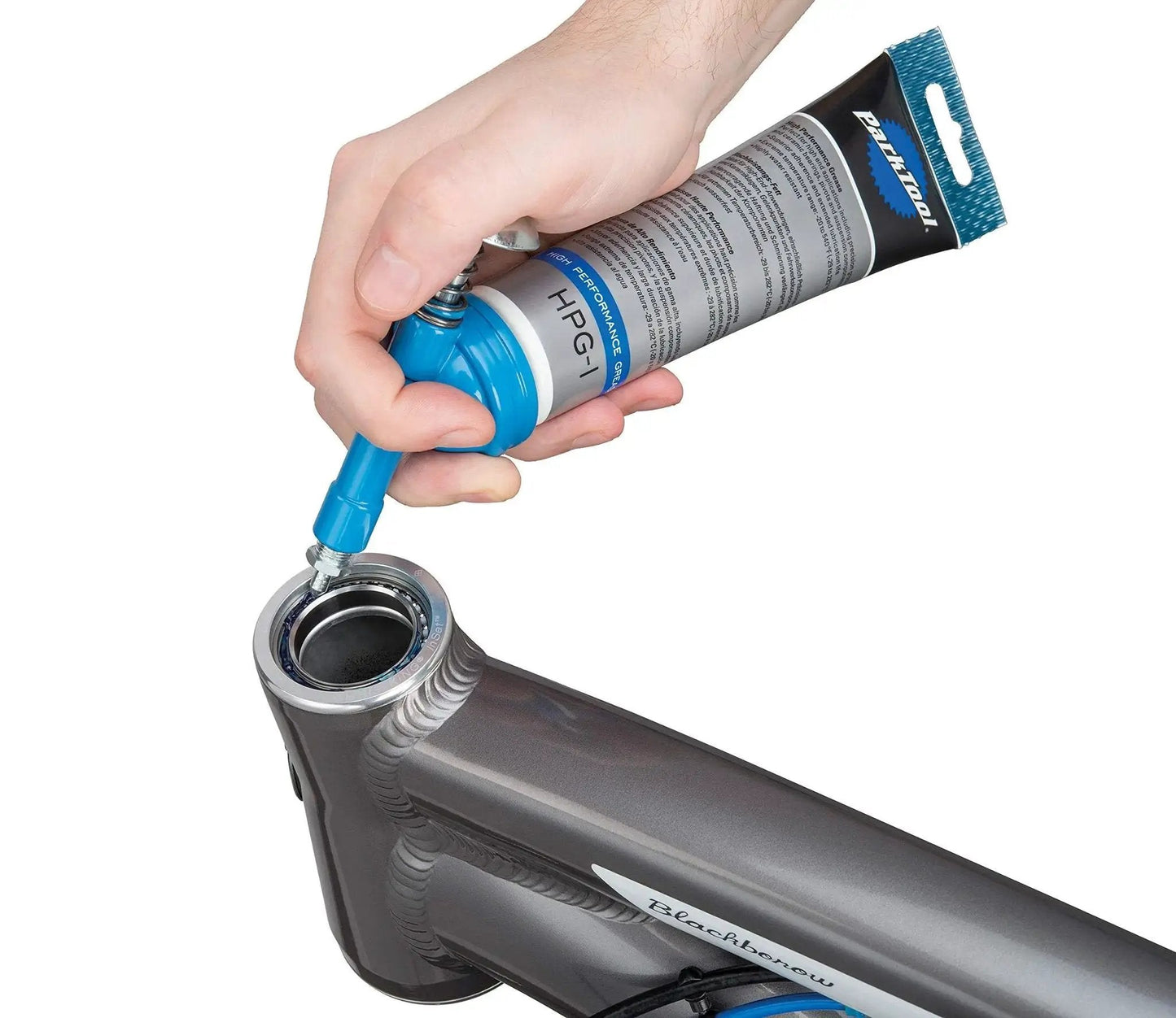 Hand using Fat Press For Precision Grease And Anti-Seize Application, Includes 3.6 Fl Oz Canister (100 mL), on bike frame.