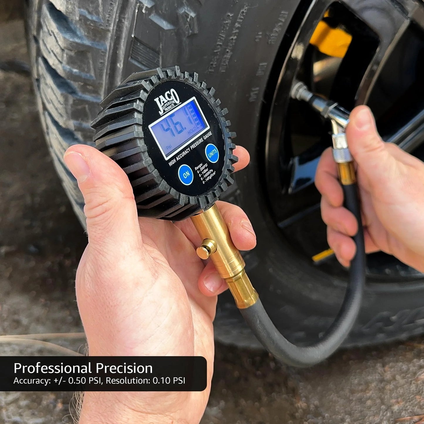 Hands using ElitePro Digital Tire Pressure Gauge Pro Grade Accuracy Up To 100 PSI With Dual Sensors Calibrated To ANSI 2A Standards on tire