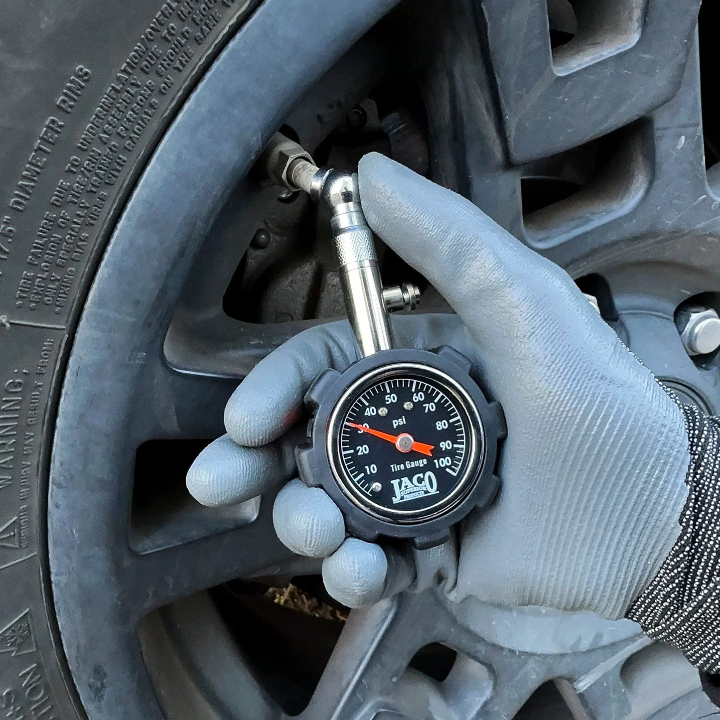 Person using Deluxe Tire Pressure Gauge For Cars And Bikes With 100 PSI Precision ANSI B40 1 Standard Calibrated Accuracy on car tire