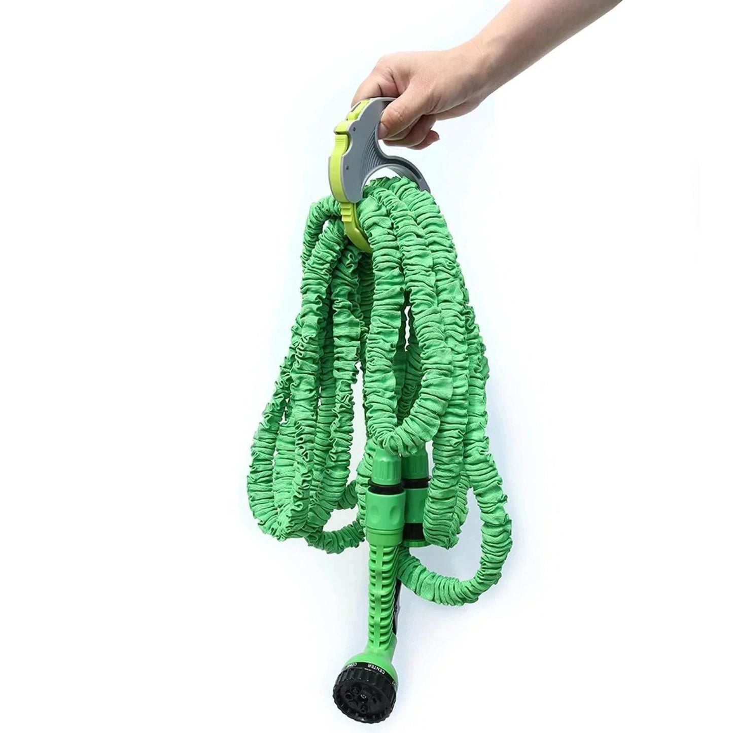 Person holding green expandable garden hose with nozzle, using Spring Ratchet Cable And Hose Clamp Organizer With Spring Loaded Wrap System