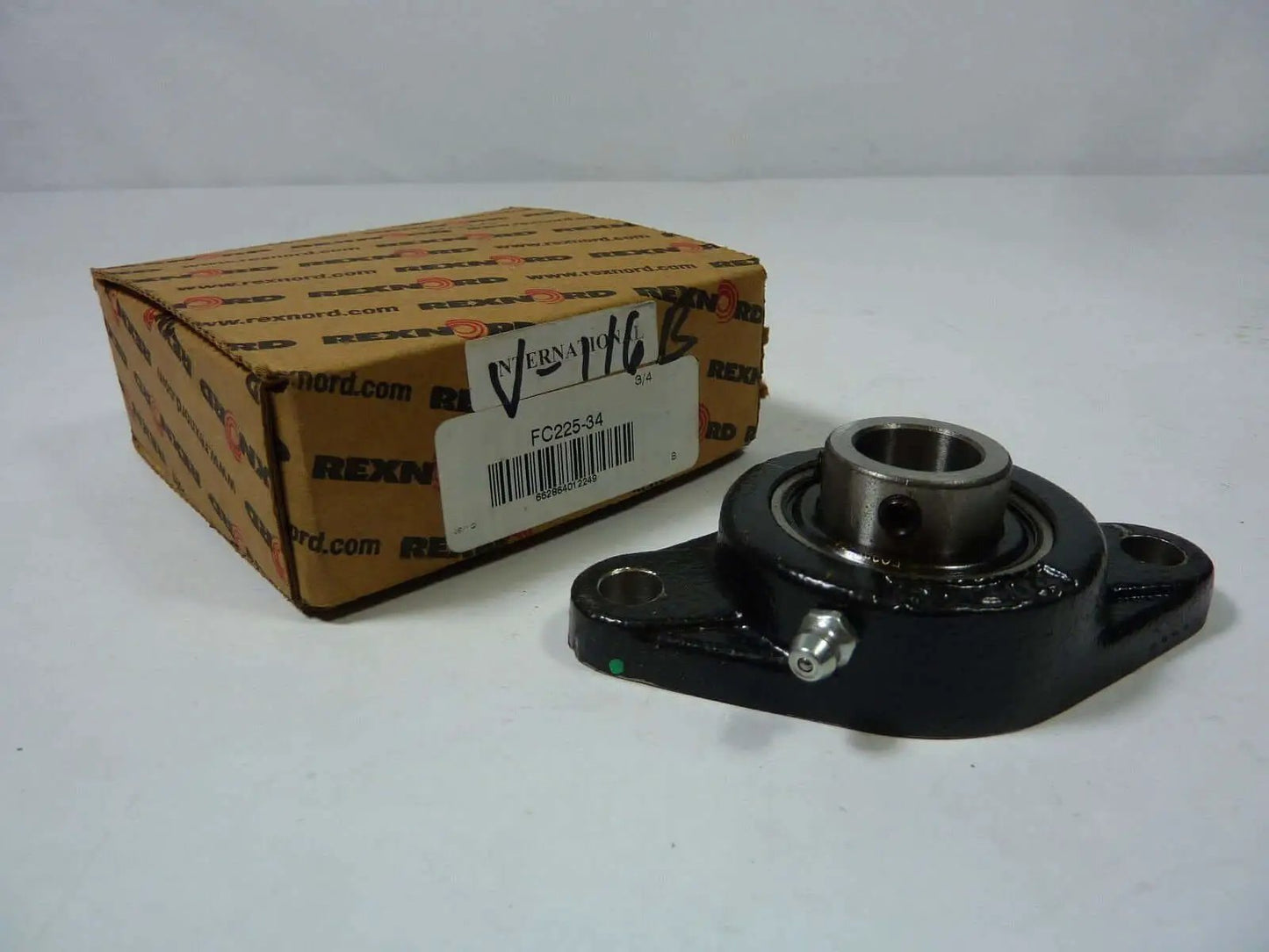 Beefy Heavy Duty Ball Bearing With Two Bolt Flange And Three Quarter Inch Shaft Rexnord FC225 34 Model New In Original Packaging Industrial Grade Bearing Premium Quality, shown with packaging