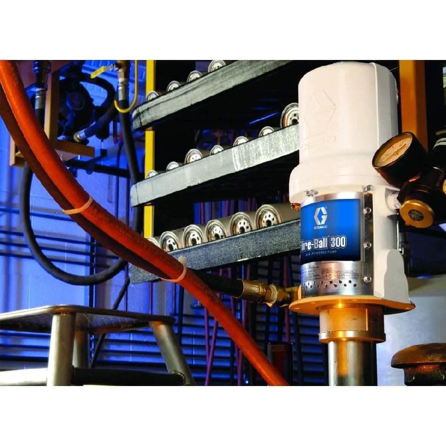 Pneumatic Drum Pump, 3/8 NPT, 140 psi installed in an industrial setting with connected hoses and pressure gauge.