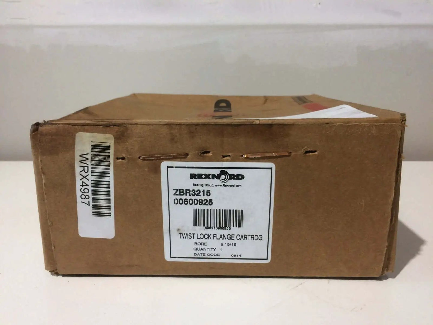 Box containing Eccentric Lock Flange Block With Relubricatable AllInOne Cast Iron Housing And Self Aligning Spherical Roller Bearing Insert Rexnord ZBR3215