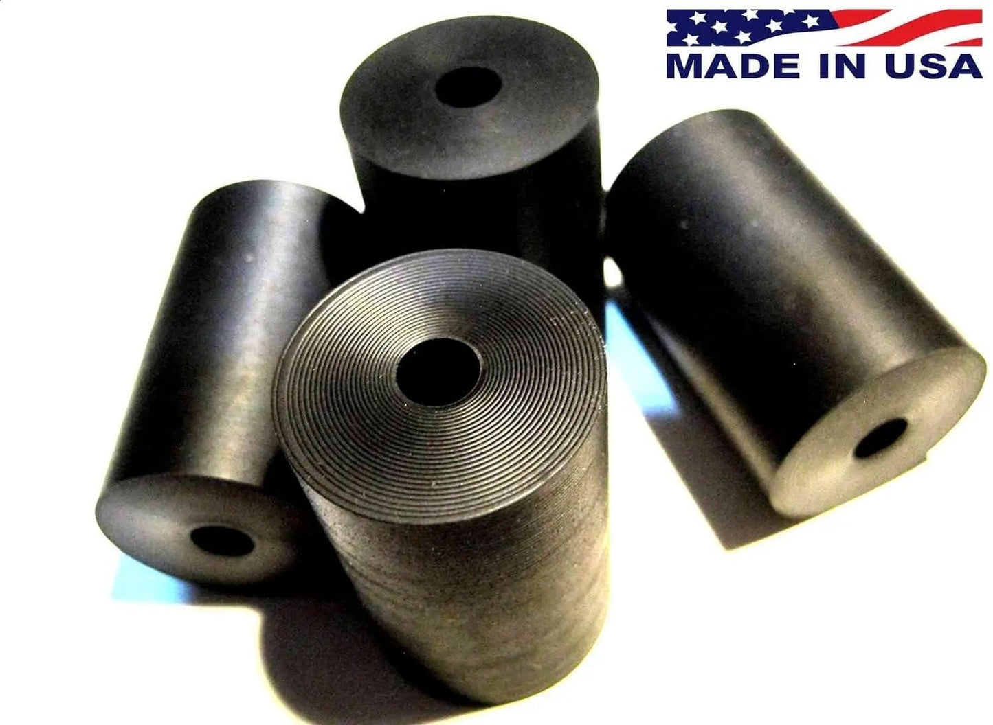 Premium Four Pack Rubber Spacer Set Made In USA For Home Industrial Automotive Marine Use Durable Anti Vibration Spacers One Inch Outer Diameter One Quarter Inch Inner Diameter One And A Half Inch Thick Izzy USA LLC, shown from top view highlighting design and material details.