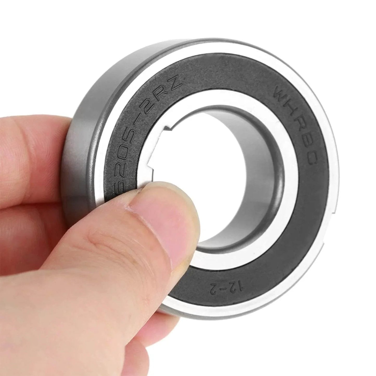 Close-up of a CSK25PP sprag clutch one-way bearing keyway freewheel clutch bearing 25 * 52 * 15mm held by a hand