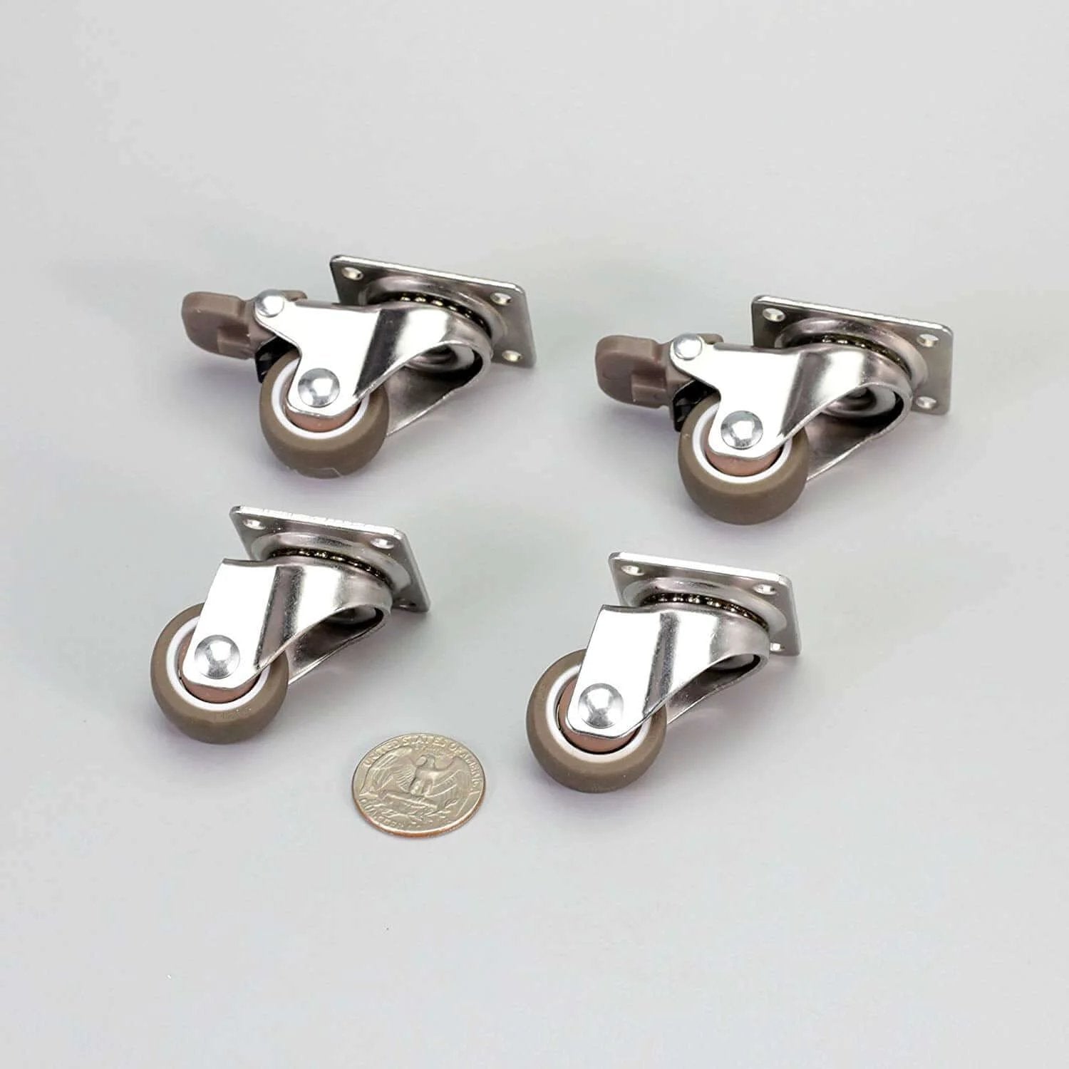 1 Inch Low Profile Swivel Caster Wheels 4 Pack with soft rubber, showing 360 degree top plate and locking mechanism next to a coin for scale.
