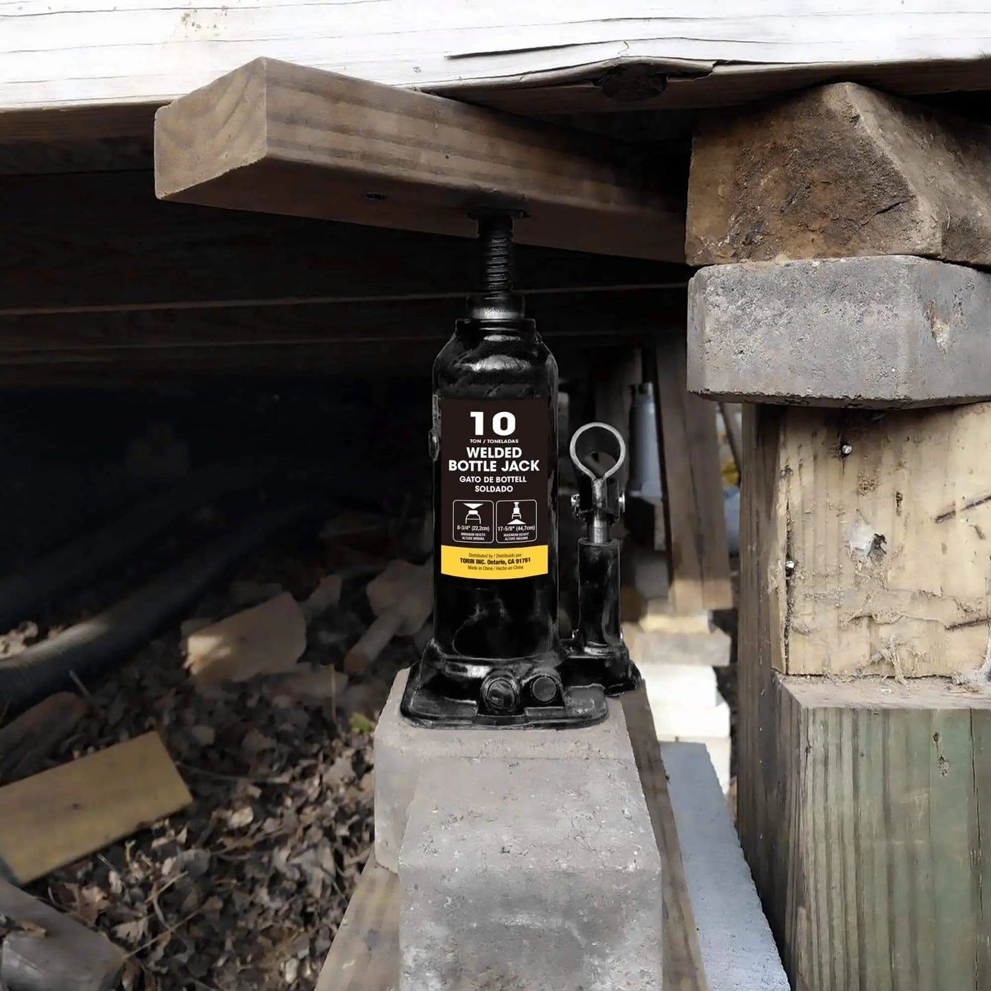 Beefy 10 Ton Hydraulic Bottle Jack For Auto Repair And Home Lifts With Wide Lift Range And Serrated Heat Treated Saddle By Torin Welded Construction Quality installed under wooden frame