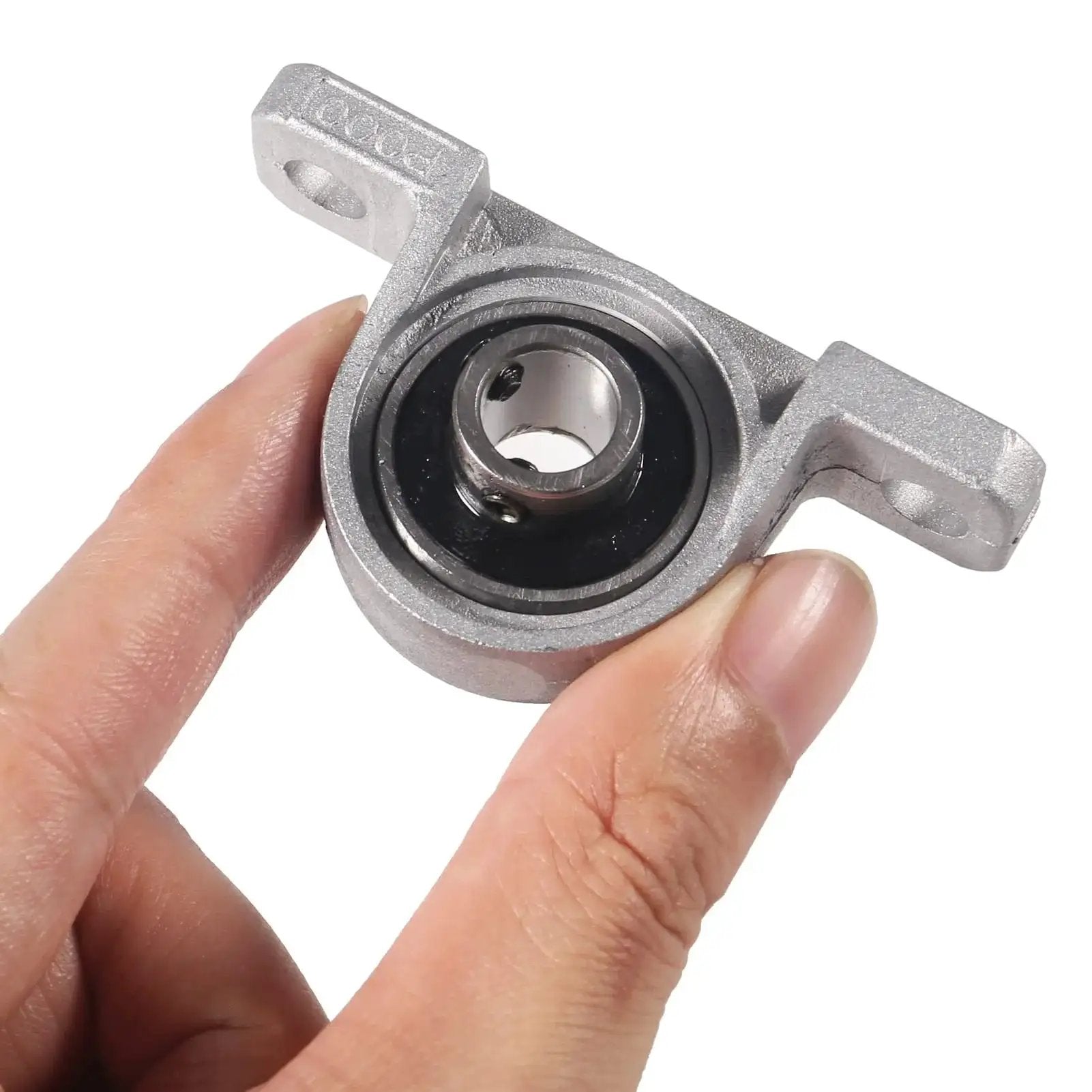 Hand holding Six Pack KP000 10mm Pillow Block Bearing Self Aligning Mounted Flange Zinc Alloy Base for machinery.