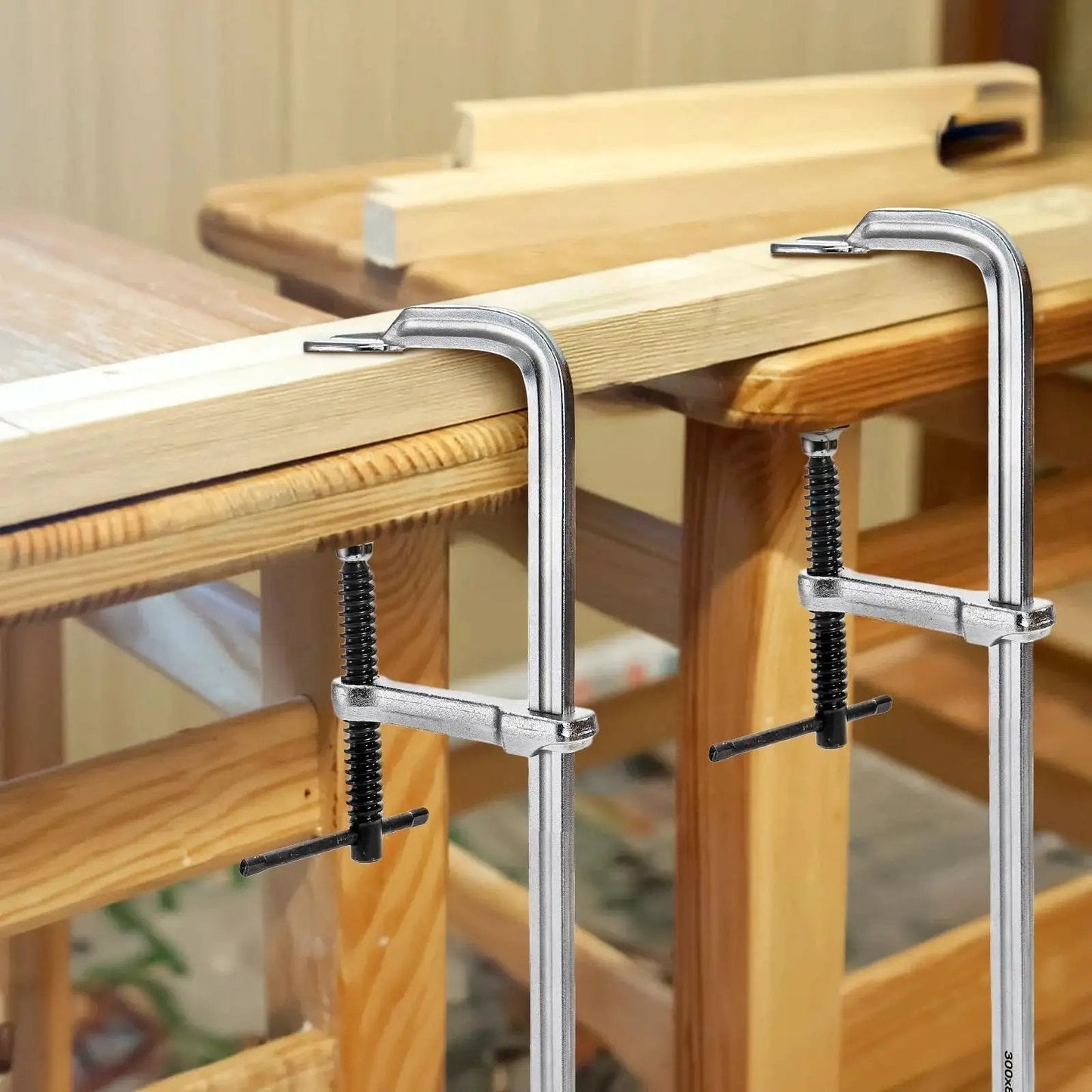 4 Pack 12 Inch Bar Clamps For Welding And Woodworking, Drop Forged Steel F Clamps in use on wooden table, light duty clamp set for crafts.