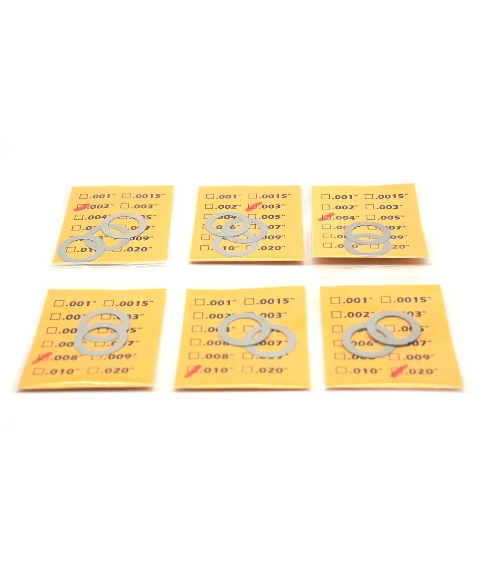 14 Pack Half Inch 28 TPI Barrel Shim Kit for .223 and 5.56 Muzzle Brakes displayed in clear segmented packaging, showing various thicknesses.