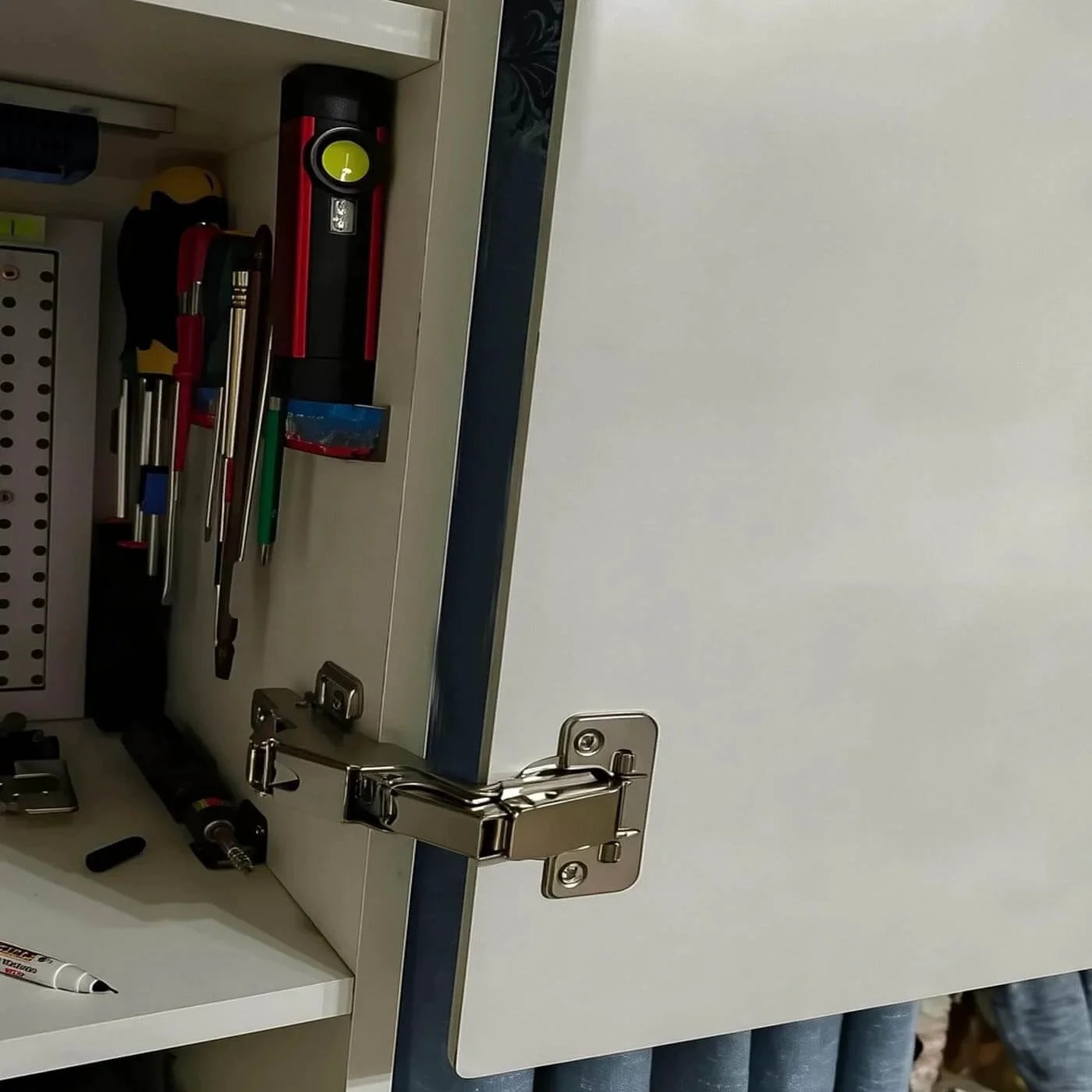 4pack 180 Degree Kitchens Cabinet Corner Cabinet Door Hinge installed on a frameless cabinet door with tools inside