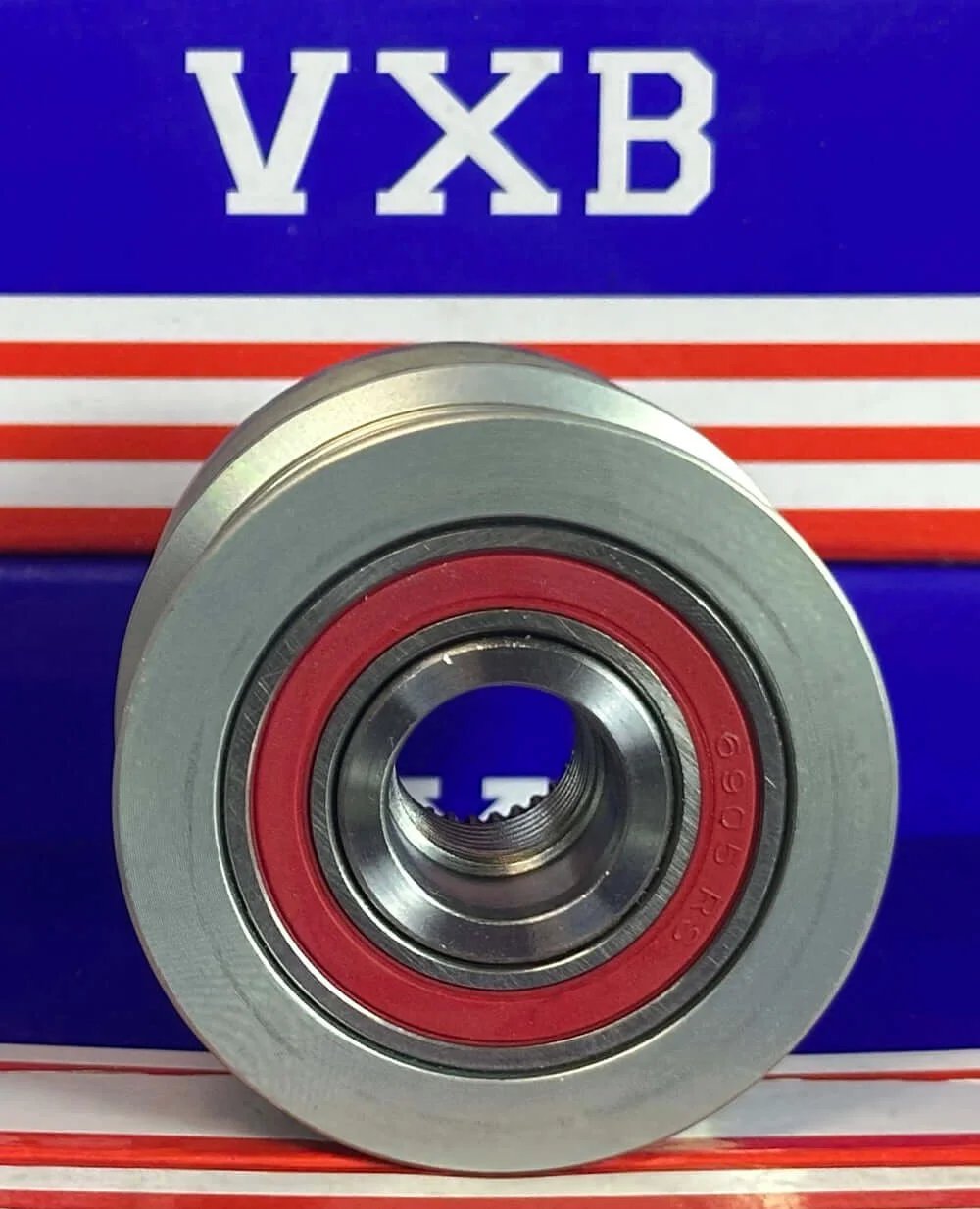 Close-up of 04E903201E Alternator Pulley Clutch - Freewheel Pulley for Audi VW Seat & Skoda showing red seal and metallic finish.