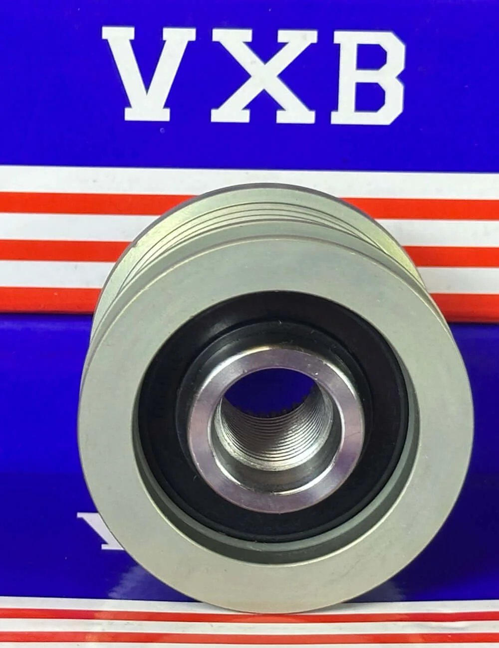 Front view of F-228824 Alternator Freewheel Clutch Pulley showing one-way clutch design and protective sealing.