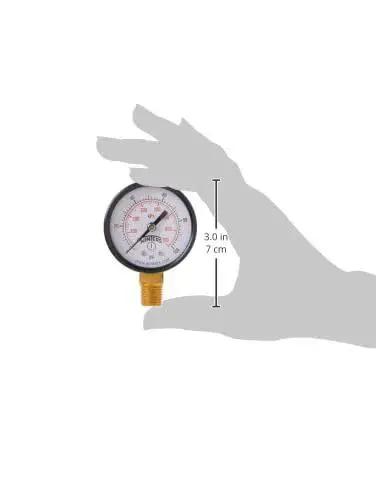 Hand holding 2 Inch Dial Dry Pressure Gauge with brass internals, black steel case, dual scale 0 to 100 Psi and KPa, bottom mount, HVAC use