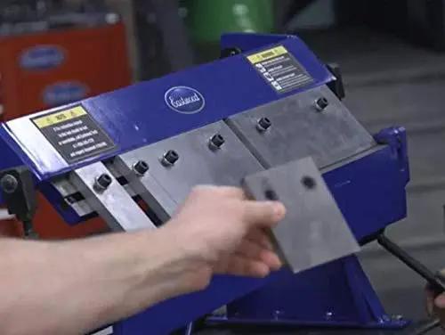 24 Inch Box And Pan Sheet Metal Brake With Five Adjustable Fingers for precision bends, close-up of metal sheet in use