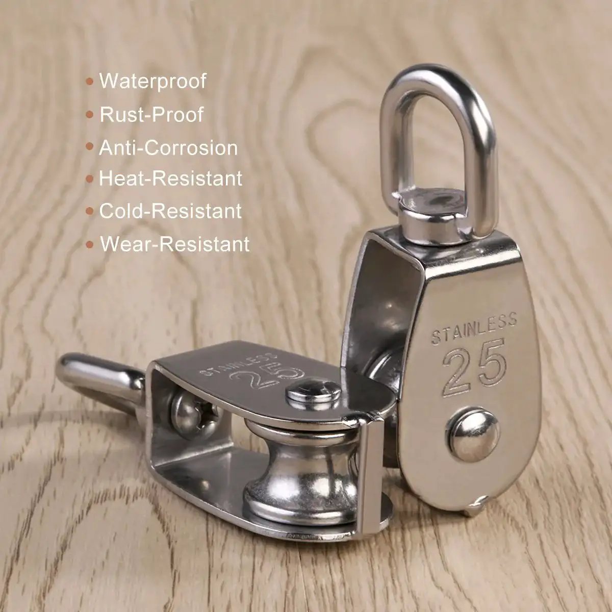 Two Pack 25mm 304 stainless steel pulley blocks with a 400 kg rating deliver reliable lifting, shown on a wooden surface.