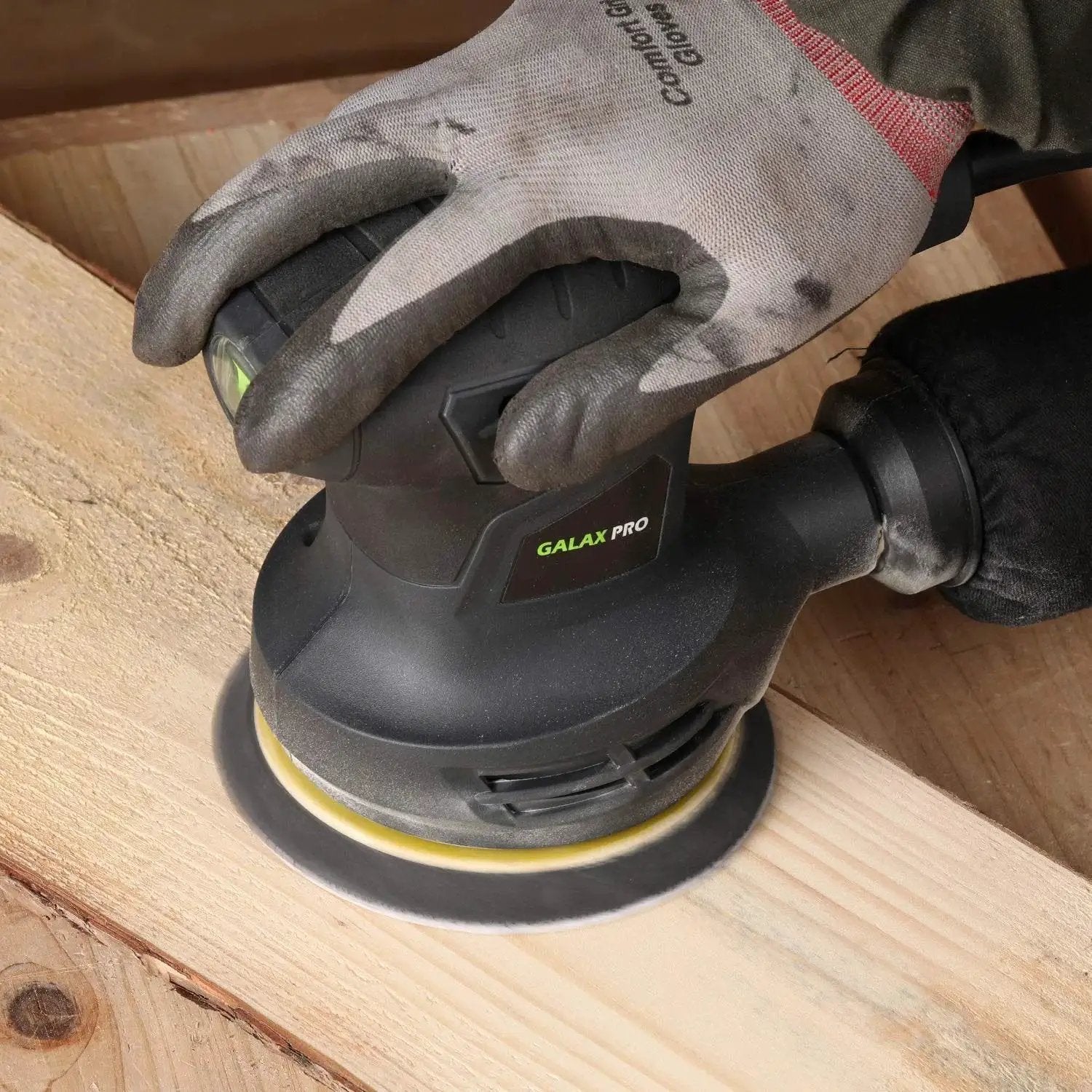 280W Orbital Sander 13000 RPM With Dust Collection And 15 Discs in use on wooden surface with ergonomic grip and dust bag.