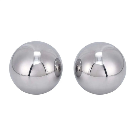 Two 2 Inch Diameter Hardened Chrome Steel Bearing Balls Two Piece Set for Precision Machines, polished and reflecting light.
