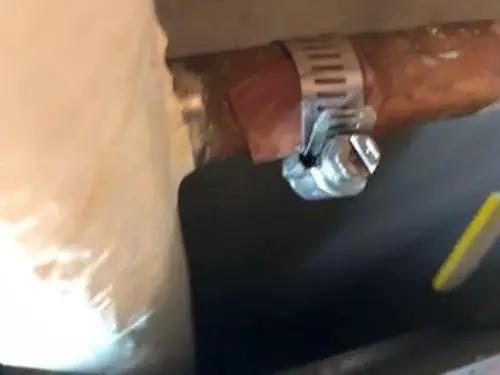 Emergency Pipe Repair Kit With 12 Patches And Clamps For Quick Leak Fix On One Quarter To One And A Quarter Inch Copper PVC And Metal Pipes No Water Shut Off Easy To Use Do It Yourself Patching For Straight Pipes And Elbows in use on copper pipe