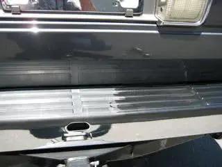 Bumper with half treated using Bumper And Trim Conditioner For Porous Black Plastic Vinyl And Rubber 32oz