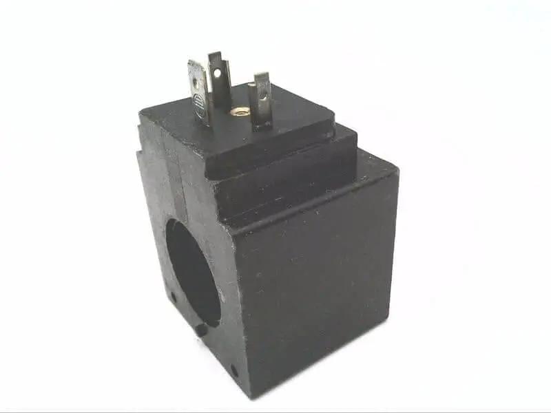 Single NG6 W110/K4 solenoid coil 110/115 VAC 50/60 Hz hydraulic valve replacement part, shown at an angle