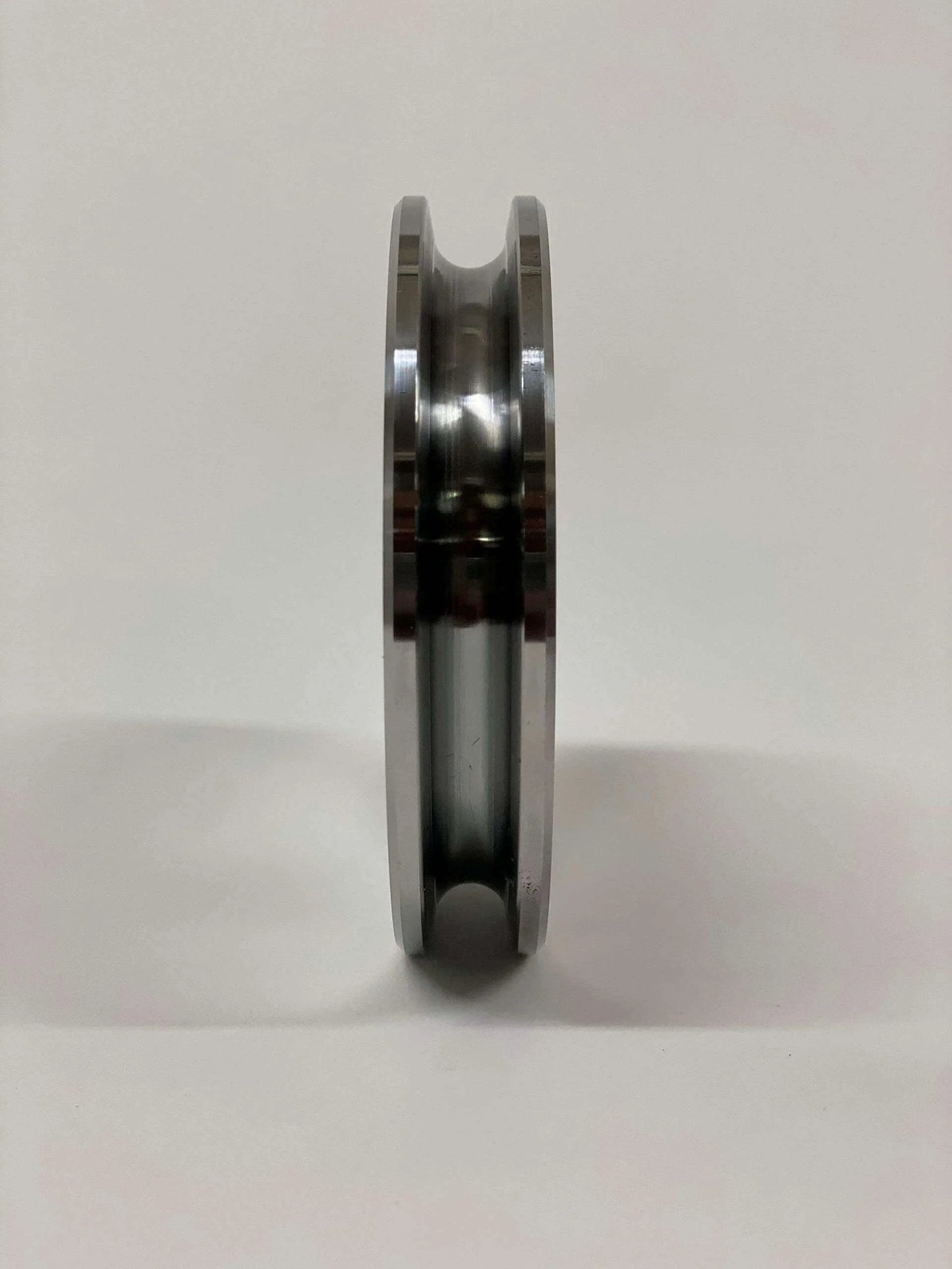 Side view of Auto Lift Parts Steel Cable Sheave 4" Pulley with 3/4" Center Hole, upgraded from nylon OEM, for 2-post lift, steel body.