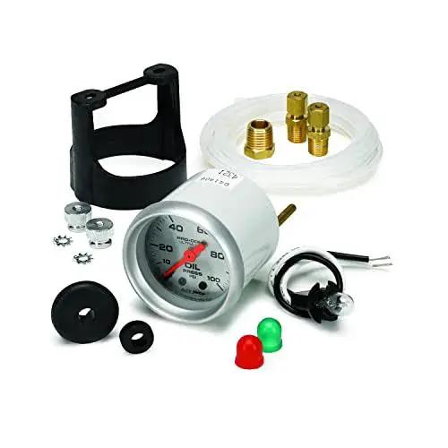 Ultra Lite Mechanical Oil Pressure Gauge 2.3125 Inch with Incandescent Dial Lighting, components and fittings displayed