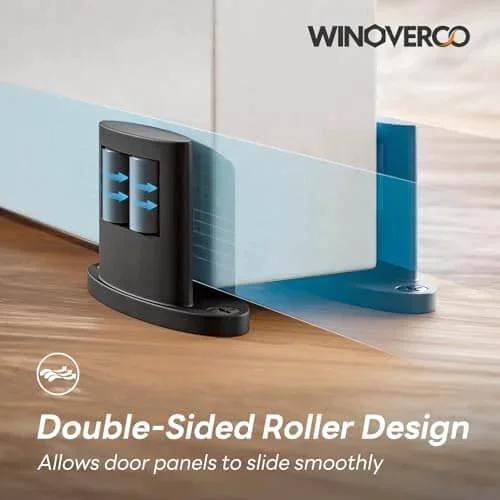 Set Of Four Sliding Barn Door Bottom Floor Guides With Double Sided Roller Design For Smooth Quiet Operation In Durable Aluminum Alloy Floor Mounted Black Finish Ideal For Farmhouse Modern Or Industrial Interior Doors - One guide installed.