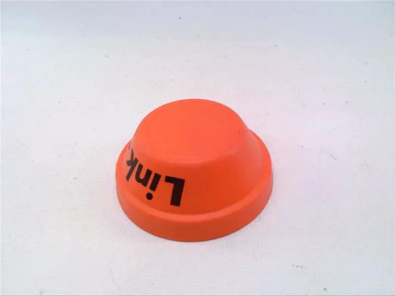 Orange plastic disc with text 'Link' printed on it, shown on a white background.