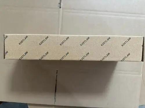 Box of Heavy Duty 7000 PSI Pistol Grip Grease Gun Kit With 14 Oz Cartridge, cardboard packaging with KRETLAW branding.
