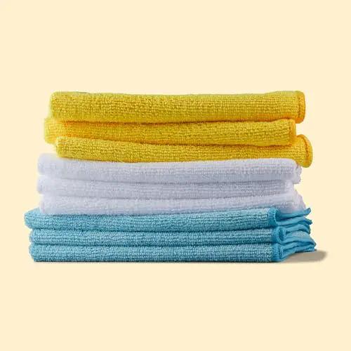 Ultra Soft Microfiber Cleaning Cloths For Car Detailing Pack Of 24 Clean Without Scratch Lint Free Streak Free Absorbent Non Abrasive Reusable And Washable In Blue White Yellow By Amazon Basics stacked in yellow, white, and blue.