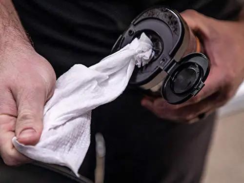 Person pulling out a wet wipe from the container of Gold Class Rich Leather Wipes For Car Care With Conditioning And UV Protection, Moisturizers Help Prevent Drying Out And Cracking, 30 Count By Meguiar's.