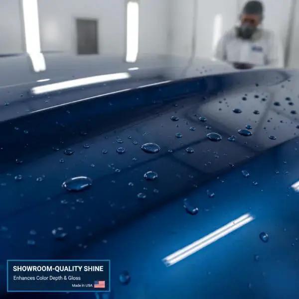 Close-up of car hood refinished with High Gloss 2K Clear Coat Kit With Hardener 4 to 1 For Refinishing 1 Gal And 1 Qt, showing water beading.