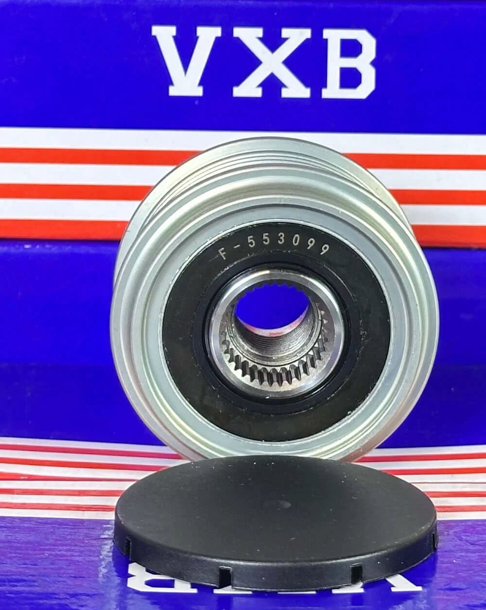 F-553099 Alternator Freewheel Clutch Pulley Bearing front view on a blue and red background, showing inner gear details.