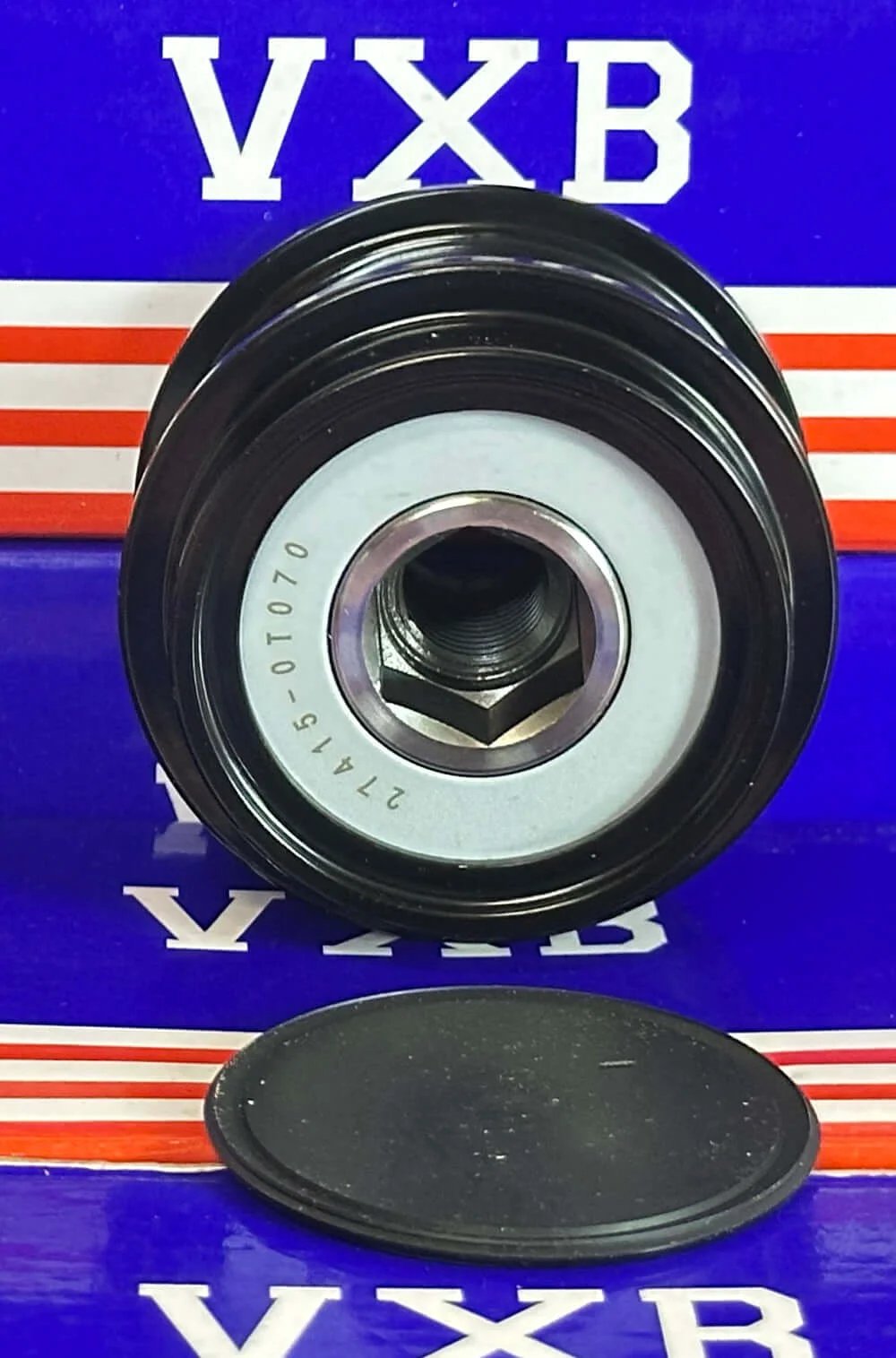 Front view of 27415-0T070 Over Running Alternator Pulley for TOYOTA Camry Corolla on display with hexagonal nut opening.