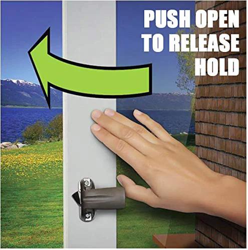Touch N Hold Smooth Dual Door Closer System in use, hand releasing the hold open feature against a scenic outdoor background.