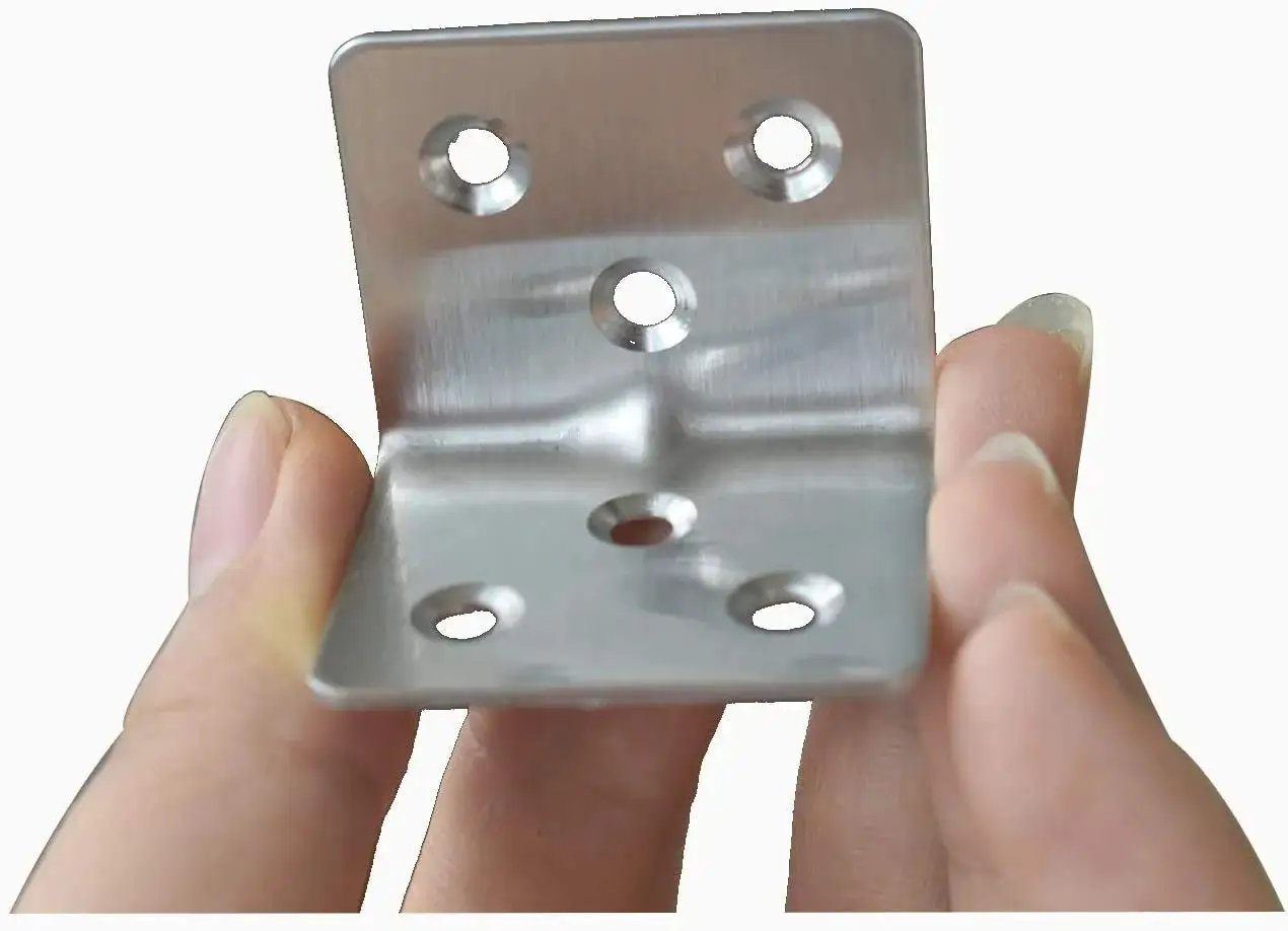 Close-up of a stainless steel corner brace showing 3 mounting holes for wood furniture support, 40 pack, 90 degree L shaped bracket.