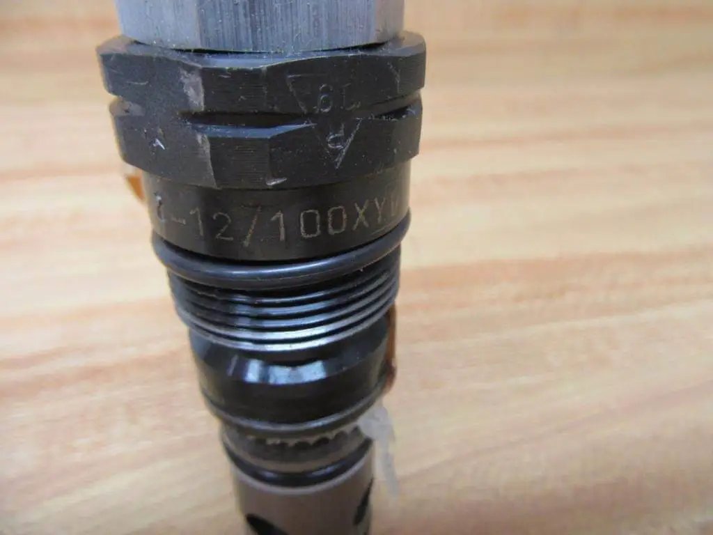 Close-up of single pilot-operated pressure relief valve DB20K2-12/100XYV 100 bar hydraulic safety regulator showing markings