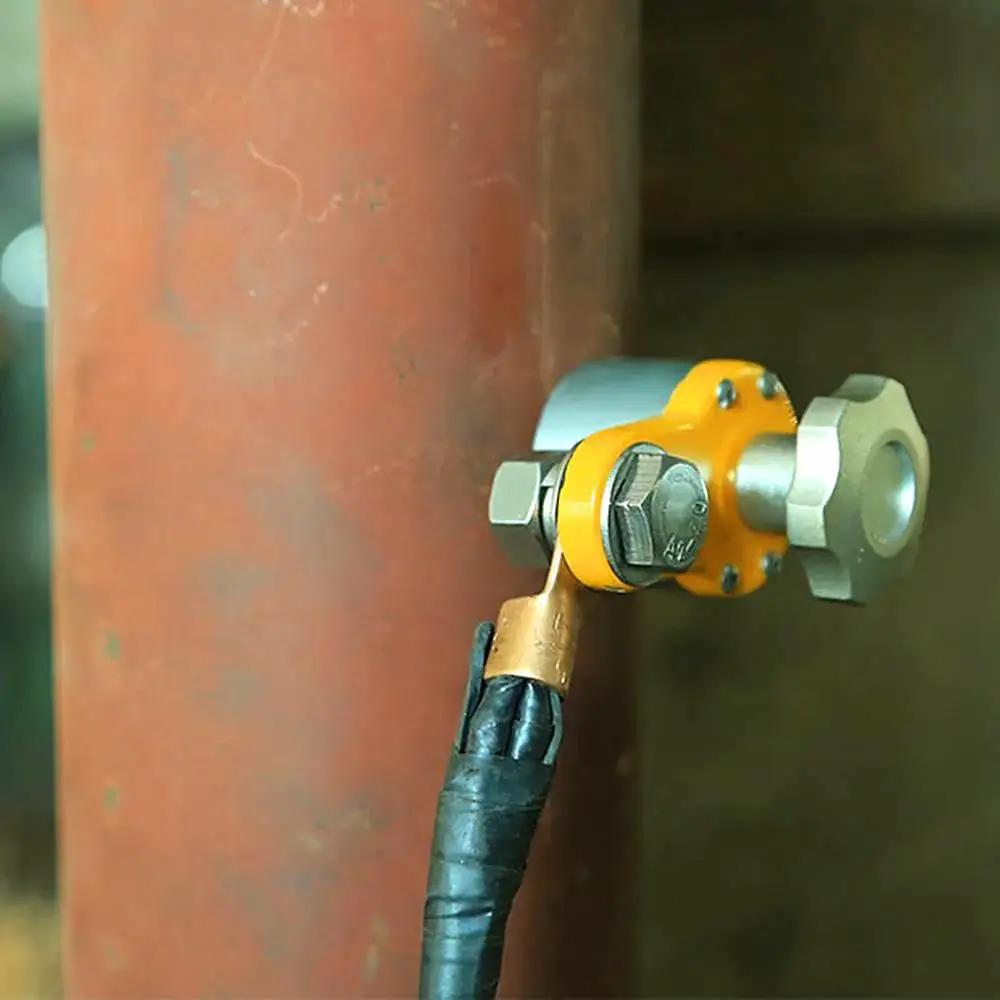 600A Magnetic Welding Ground Clamp Switchable Magnet Welding Holder attached to a metal pipe with grounding connector