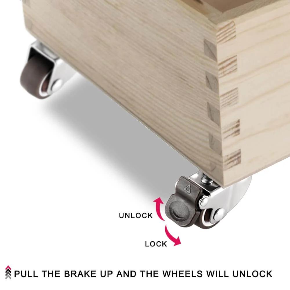 Close-up of Small Caster Wheels 1" - Low Profile Swivel Casters Set of 4, showing brake mechanism on a wooden storage box.