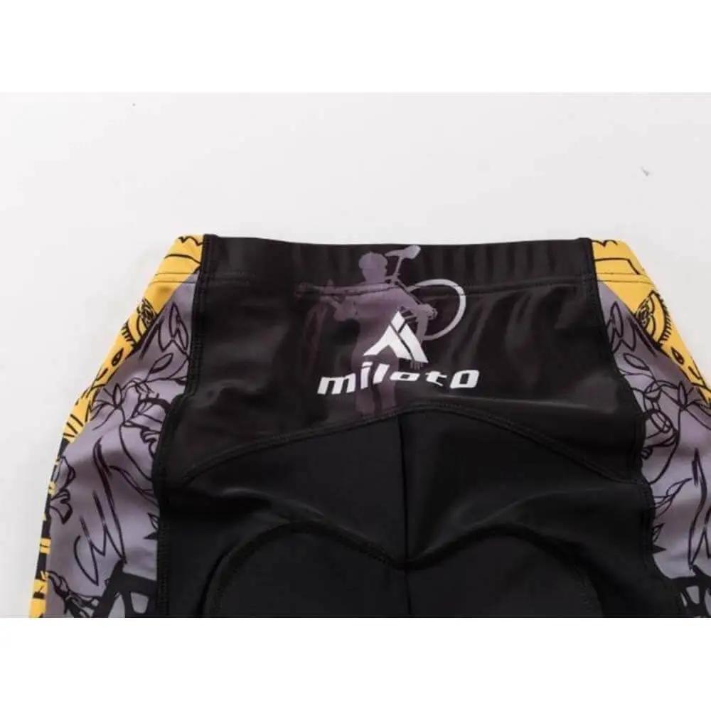 Back view of cycling shorts with colorful design and logo, featuring floral graphics and black-yellow pattern detailing.