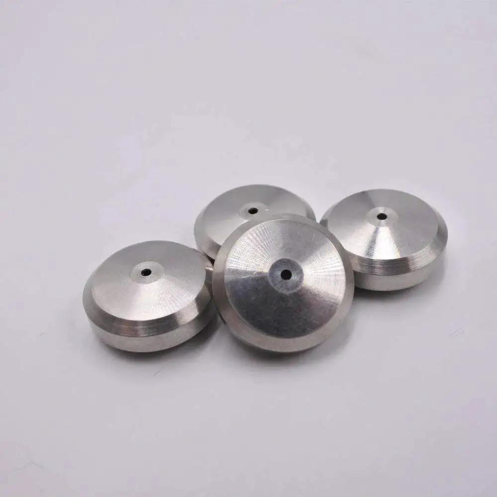 Four metal discs, part of the Three Pack Waterjet Cutting Machine Seat Seal 004003 1 Replacement Part For Precise Sealing And Leak Prevention Durable Spare Component For Reliable Waterjet Performance.