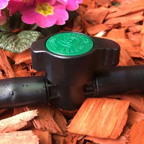 Two Pack Inline Barbed Ball Valve for Three Quarter Inch Tubing installed in garden setting