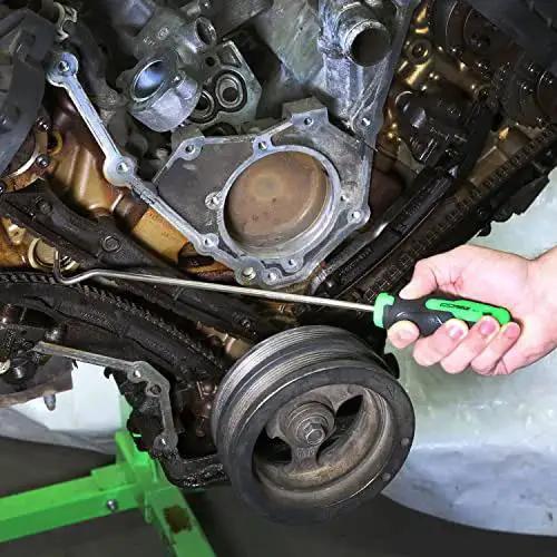 Person using 5 Piece Hose Removal Set For Radiator And Coolant Lines With Cotter Pin Tool in engine bay close-up