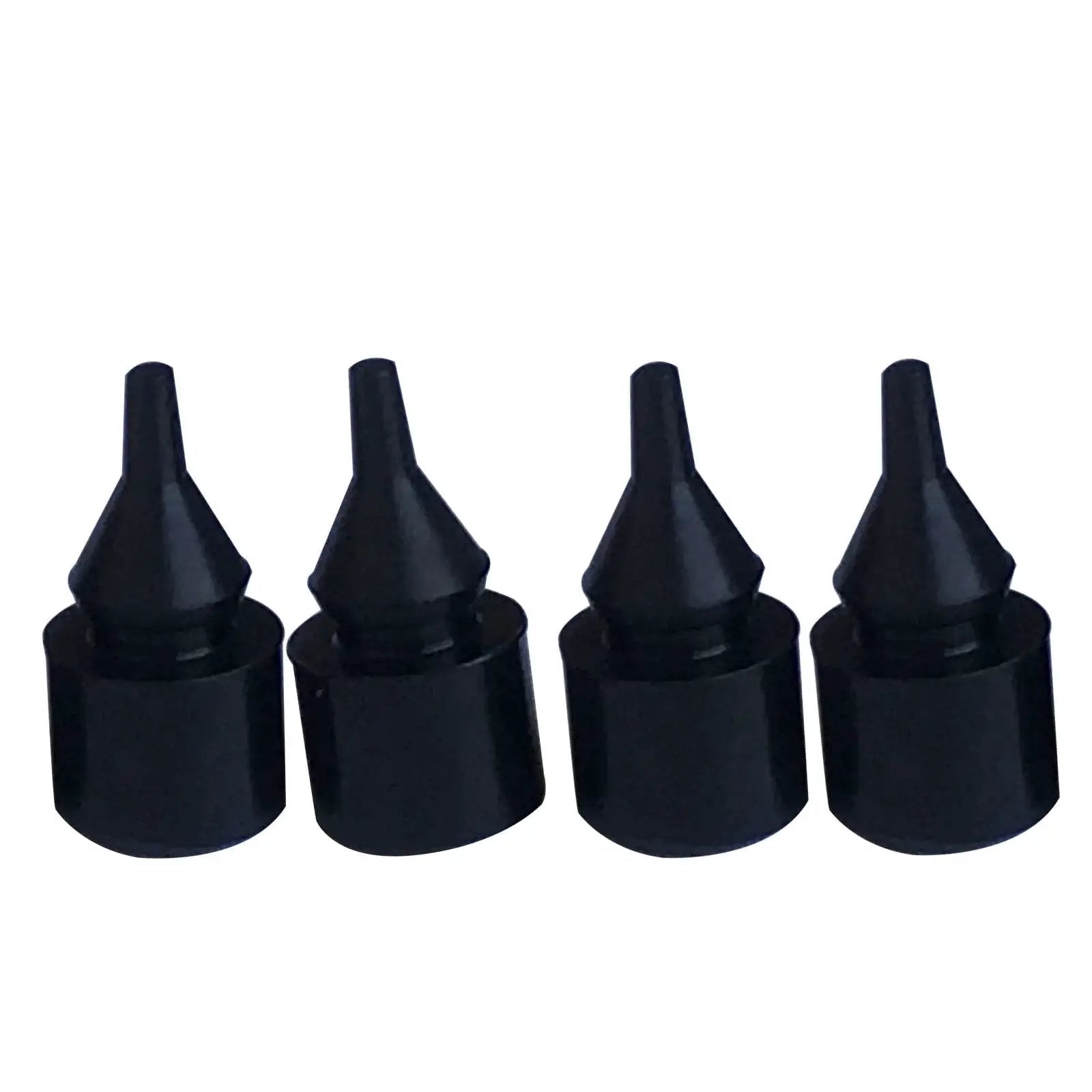Close-up of four black rubber bumpers from the Eight Piece Fuel Tank Filler Door Rubber Bumper Set For GM Trucks And SUVs.