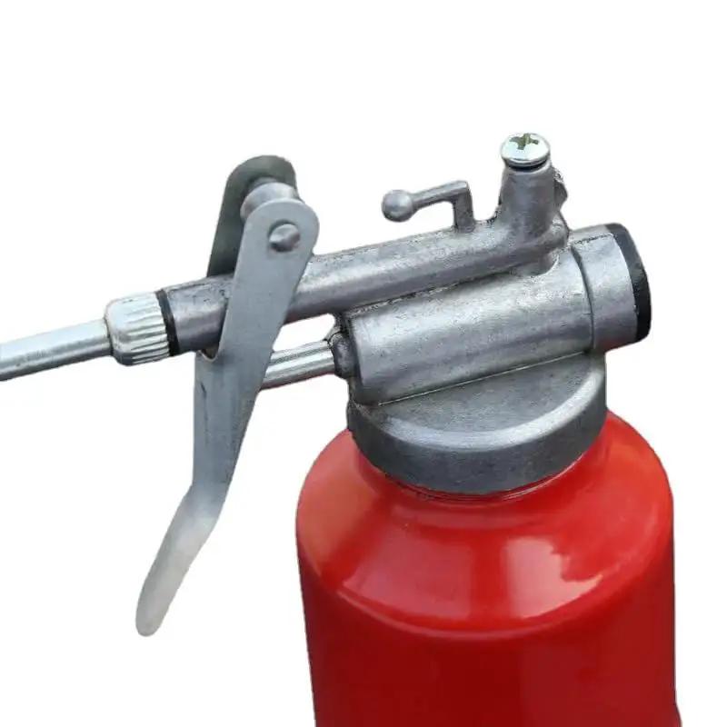 Close-up of a red 250ml hand pump oil can with straight spout, high pressure metal oiler bottle for precise lubrication, durable aluminum zinc alloy.